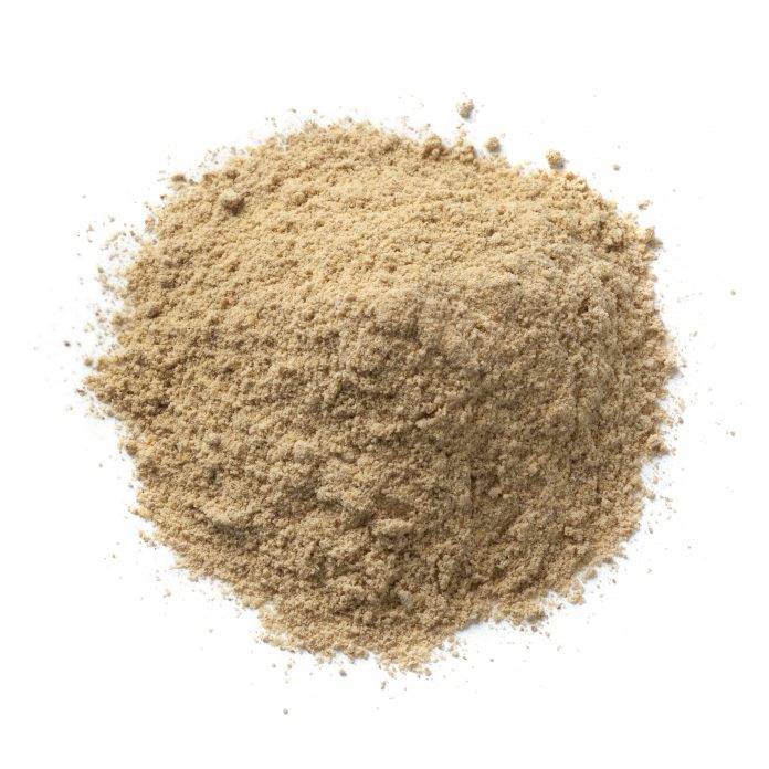 Heap of ground kencur powder on white background